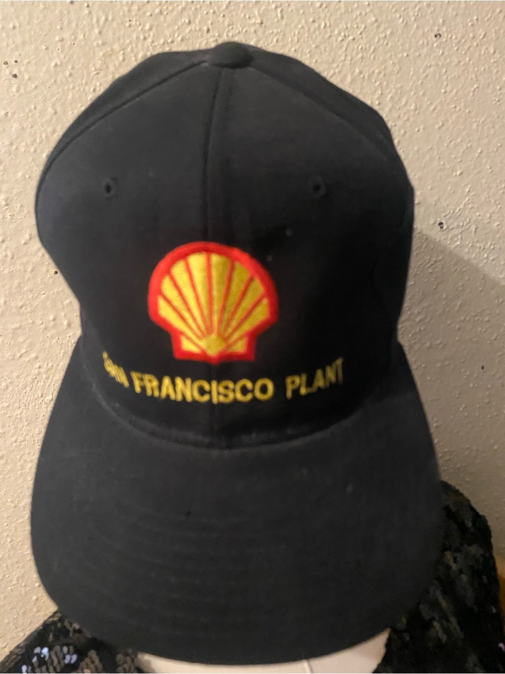 Source Unknown Black Cap with Yellow & Red Shell Logo